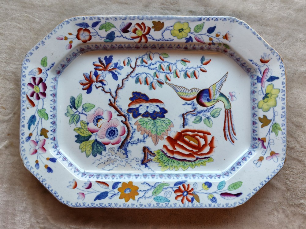An octagonal antique Masons ironstone serving platter featuring hand-painted Chinoiserie floral patterns and a bird of paradise motif.