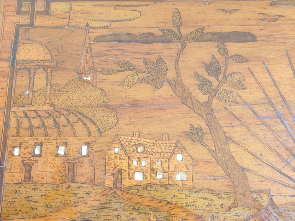 An 18th-century Dutch marquetry side table featuring a pictorial inlaid tabletop depicting a landscape, a floral drawer front, cabriole legs, and brass mounts. View VII