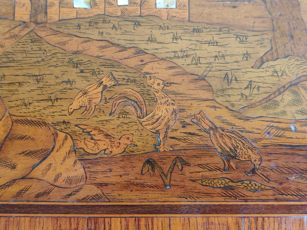 An 18th-century Dutch marquetry side table featuring a pictorial inlaid tabletop depicting a landscape, a floral drawer front, cabriole legs, and brass mounts. View VIII