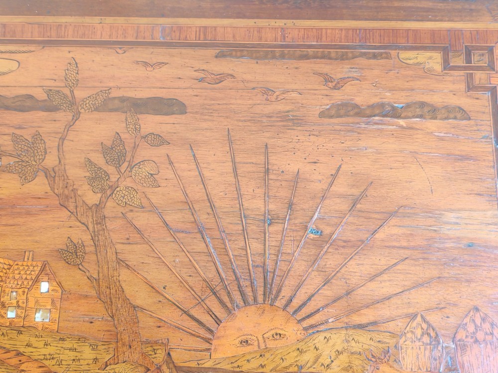 An 18th-century Dutch marquetry side table featuring a pictorial inlaid tabletop depicting a landscape, a floral drawer front, cabriole legs, and brass mounts. View IX