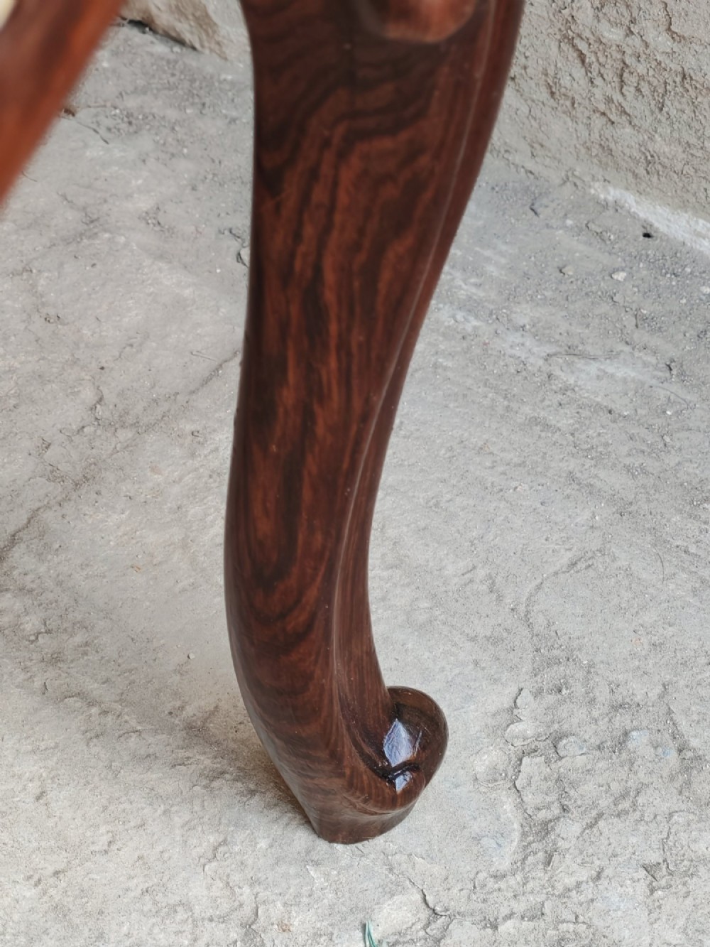 A mid-19th century rosewood stool with carved cabriole legs and a burgundy patterned upholstered seat trimmed with gold braid. View VIII