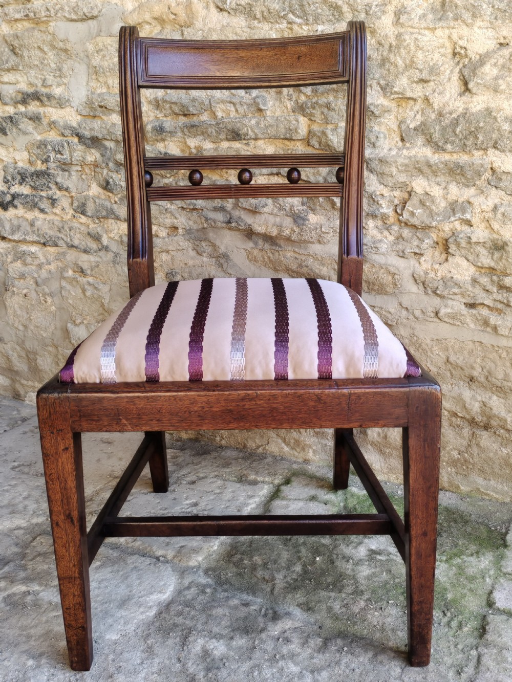 A pair of antique mahogany side chairs featuring reeded frames, a ball-ornamented mid-rail, and striped upholstered seats. View II