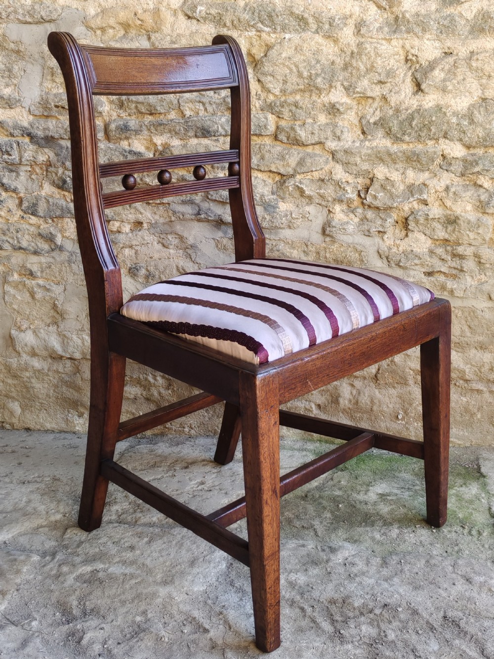 A pair of antique mahogany side chairs featuring reeded frames, a ball-ornamented mid-rail, and striped upholstered seats. View III