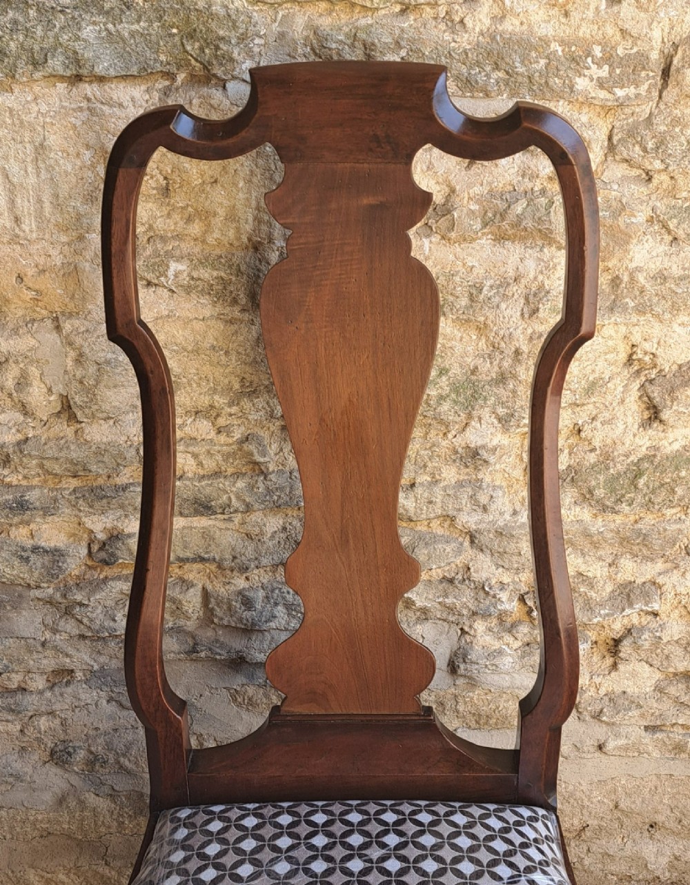 A Queen Anne walnut side chair featuring a shaped vase back splat, patterned drop-in seat, and cabriole front legs with pad feet. View IV