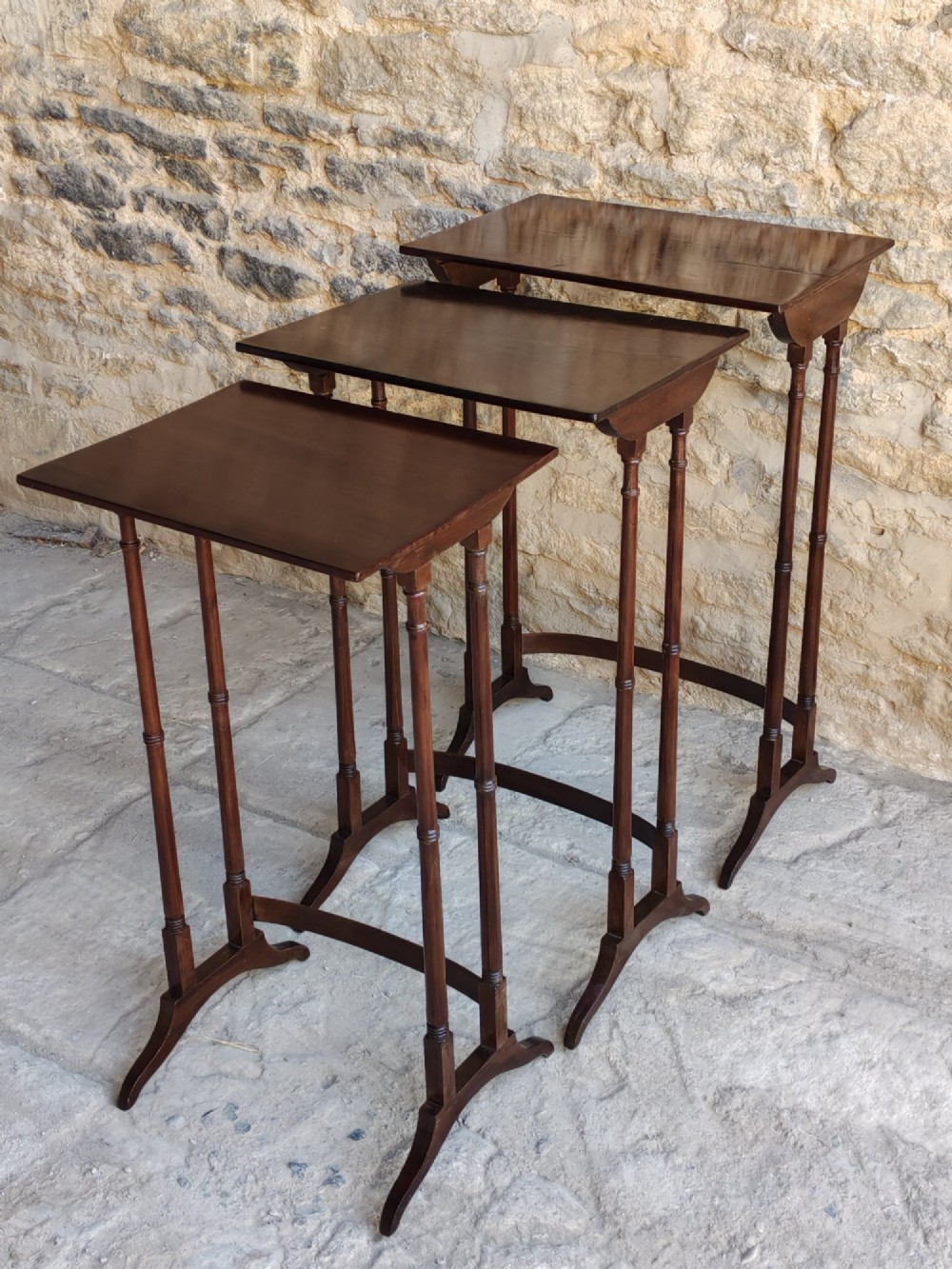 Nest of three Georgian mahogany tables.
