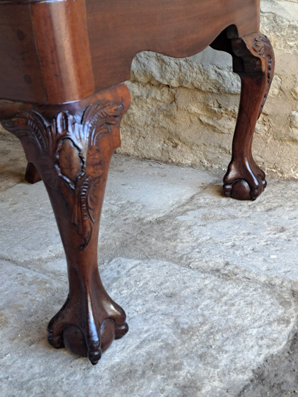 A mid-18th century walnut side chair featuring an intricate carved splat back, purple velvet drop-in seat, and cabriole legs ending in ball and claw feet. View VI
