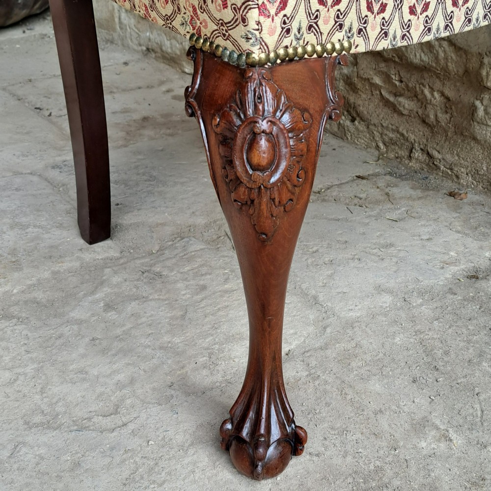 A mid 19th-century mahogany Chippendale style side chair featuring a carved pierced back splat, patterned fabric seat, and cabriole legs with ball and claw feet. View VII