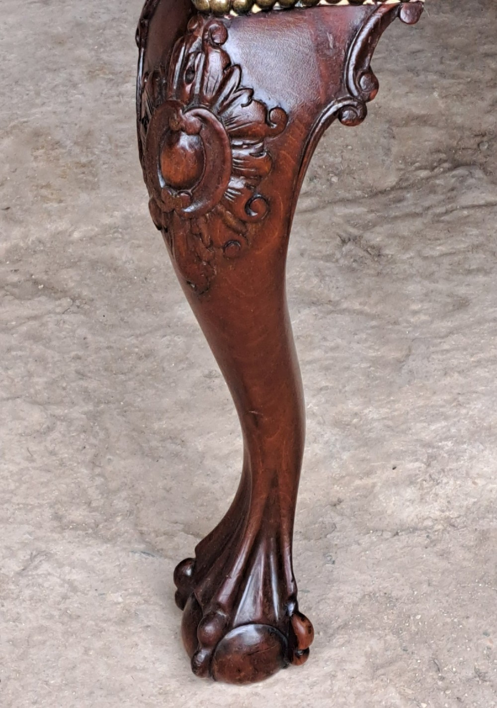 A mid 19th-century mahogany Chippendale style side chair featuring a carved pierced back splat, patterned fabric seat, and cabriole legs with ball and claw feet. View VIII