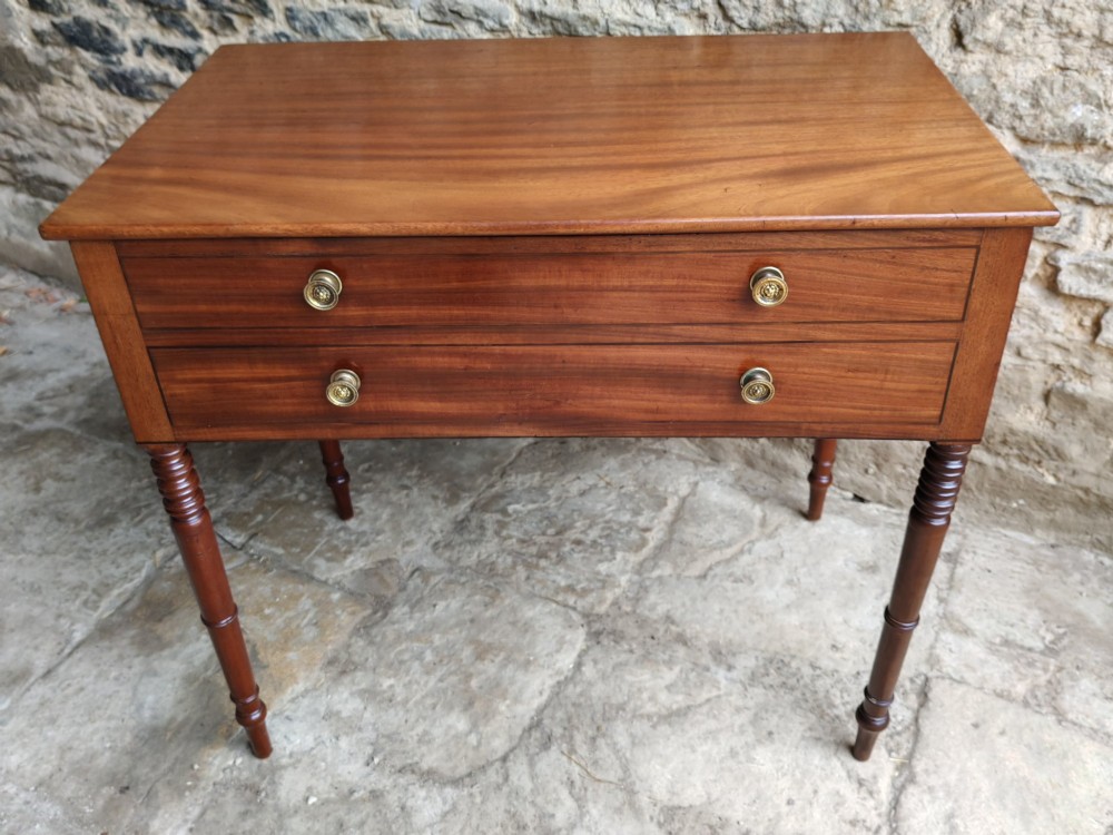 A mid-19th century mahogany work table with an open hinged lid revealing a removable fitted compartment tray set atop turned legs. View III