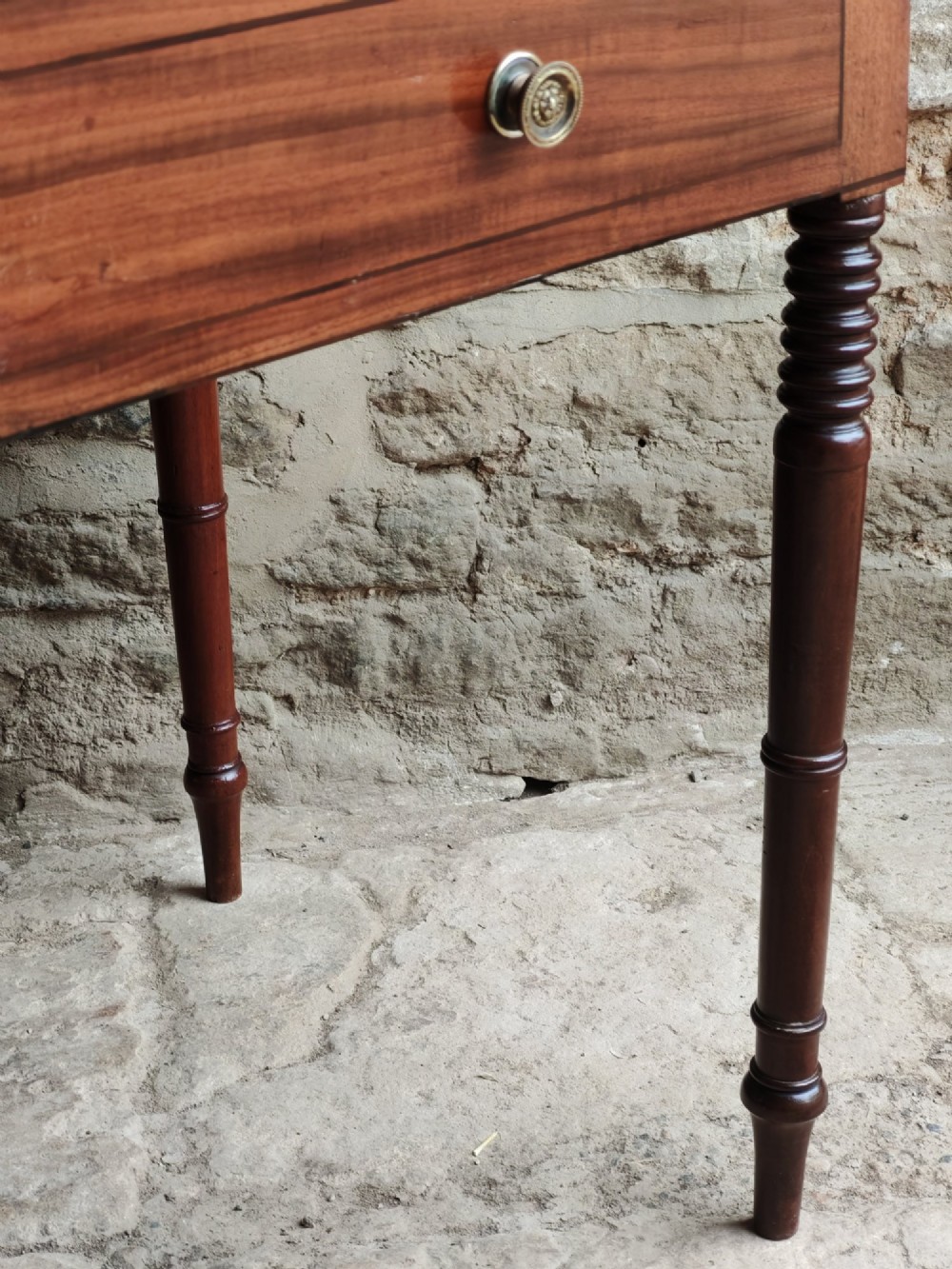 A mid-19th century mahogany work table with an open hinged lid revealing a removable fitted compartment tray set atop turned legs. View VIII