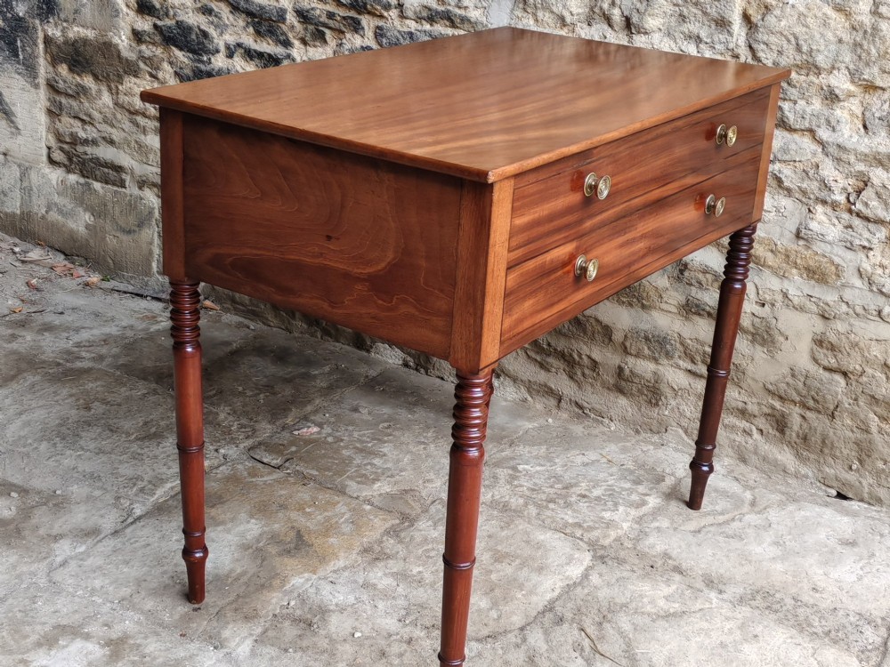 A mid-19th century mahogany work table with an open hinged lid revealing a removable fitted compartment tray set atop turned legs. View IX