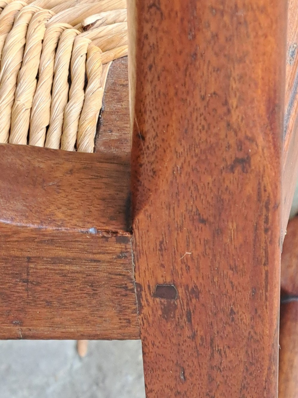 An early 18th-century Queen Anne walnut side chair featuring a vase-shaped splat back, woven rush seat, cabriole front legs, and turned stretchers. View IX