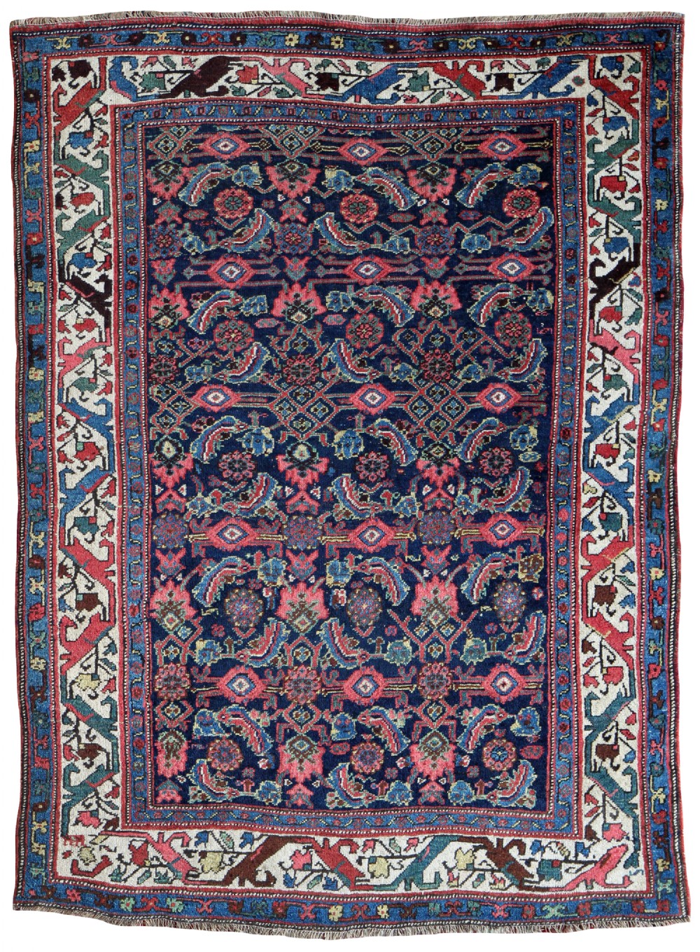 A hand-knotted Persian Bidjar wool rug featuring an all-over floral pattern on a navy blue background surrounded by decorative geometric borders.