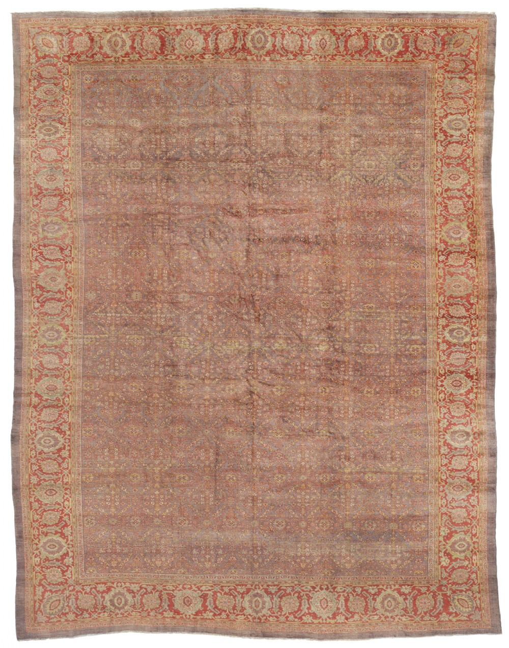 An antique Persian Mahal carpet displaying a terracotta red field with an all-over muted floral lattice motif and a decorative palmette border.