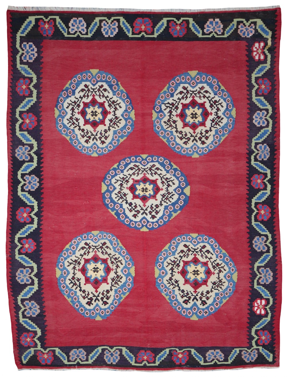 An antique Bessarabian wool flatweave kilim featuring five round floral medallions on a red central field within a dark blue floral border.