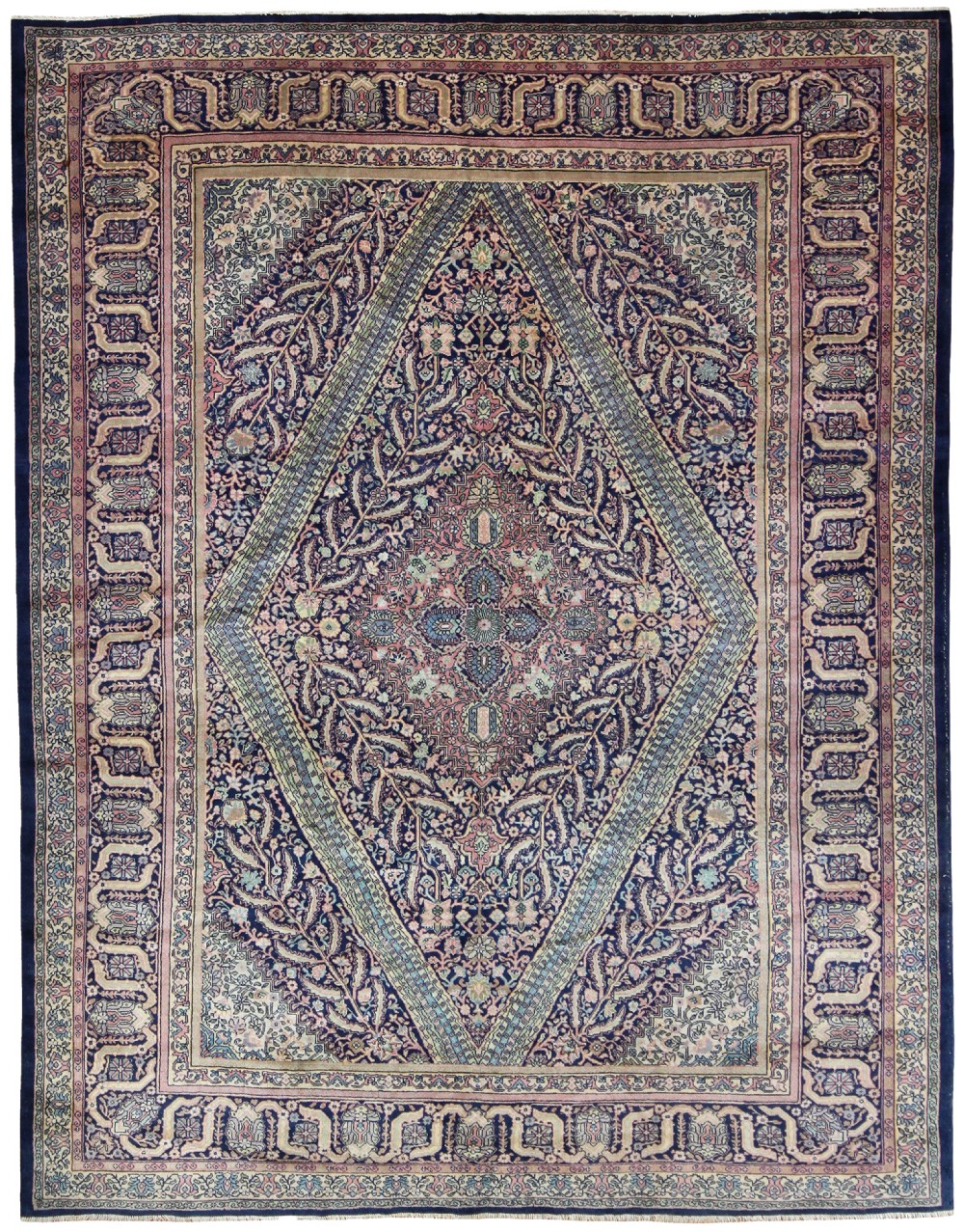 An antique hand-knotted Sivas wool carpet featuring a prominent central diamond medallion and detailed floral motifs in navy blue, rose pink, and ivory.
