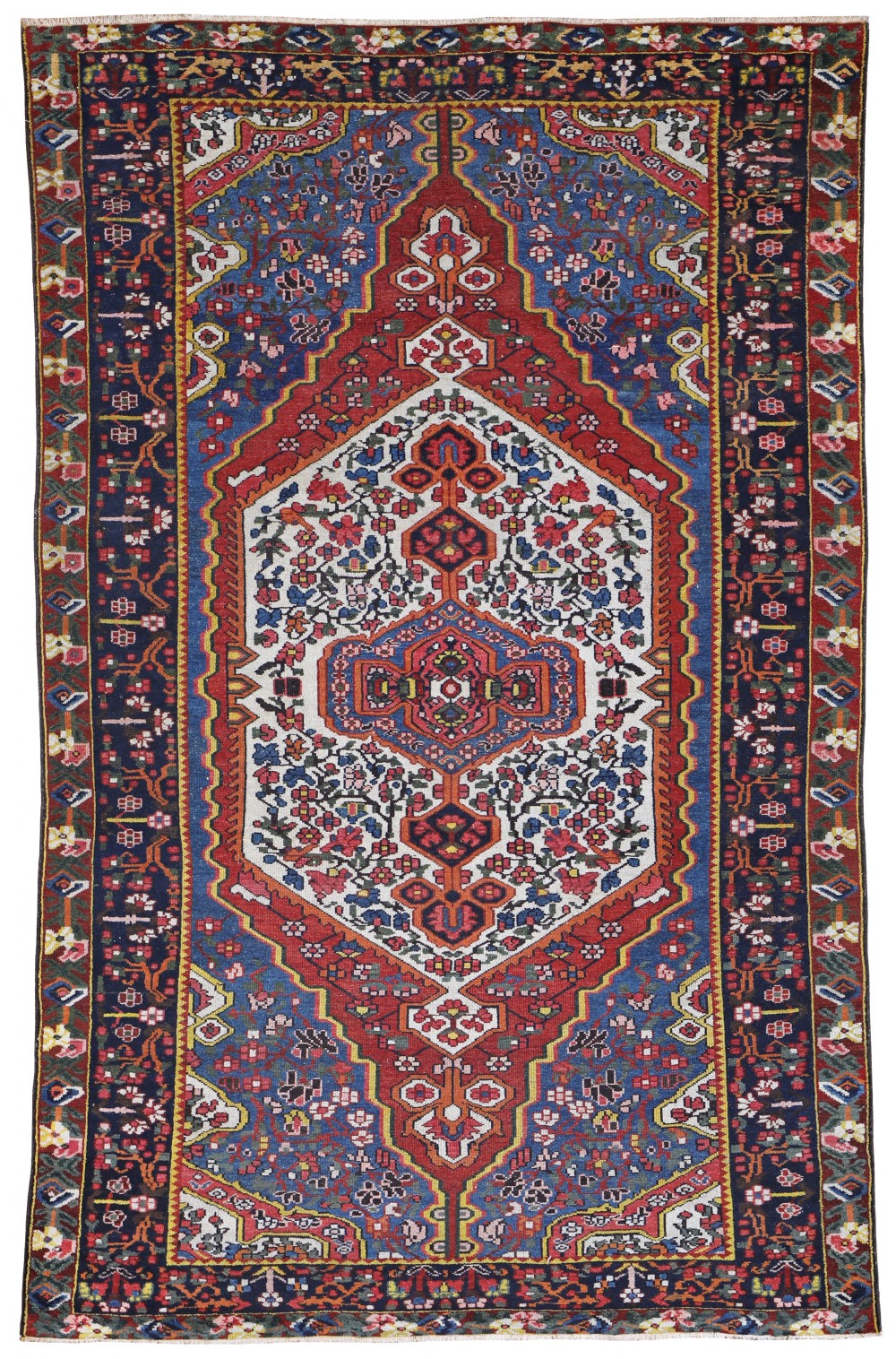 An antique hand-knotted Bakhtiari wool rug featuring a central layered diamond medallion surrounded by floral motifs in red, white, and navy blue.