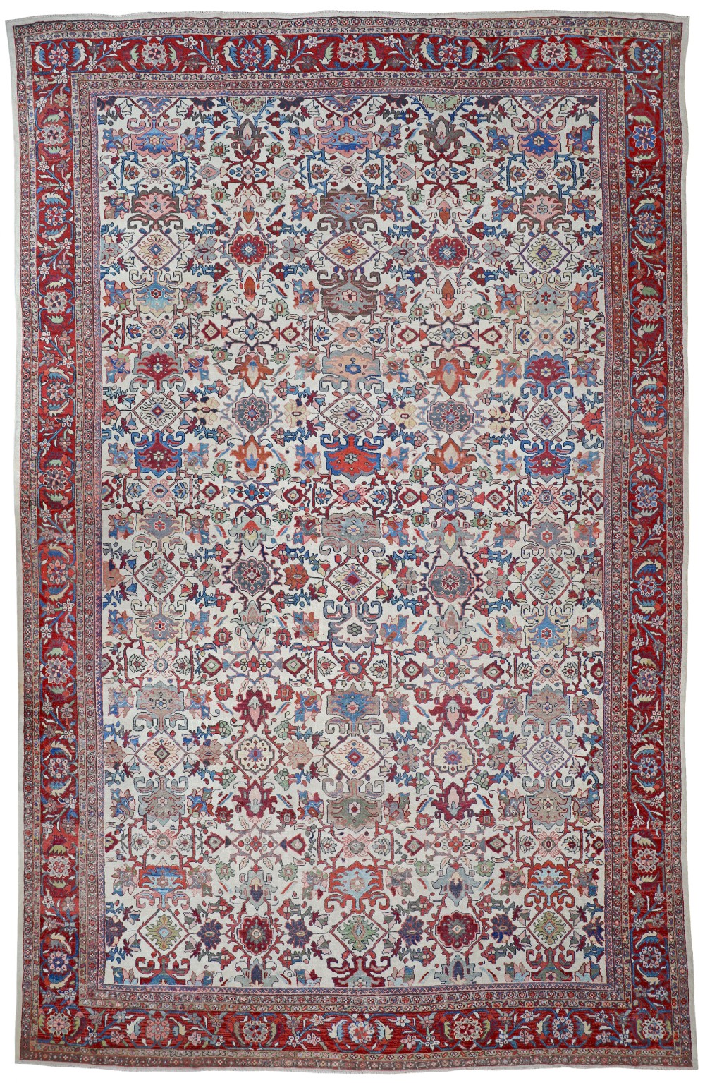 An antique hand-knotted Persian Mahal carpet featuring a cream field covered in red, blue, and pastel floral motifs within a wide red border.