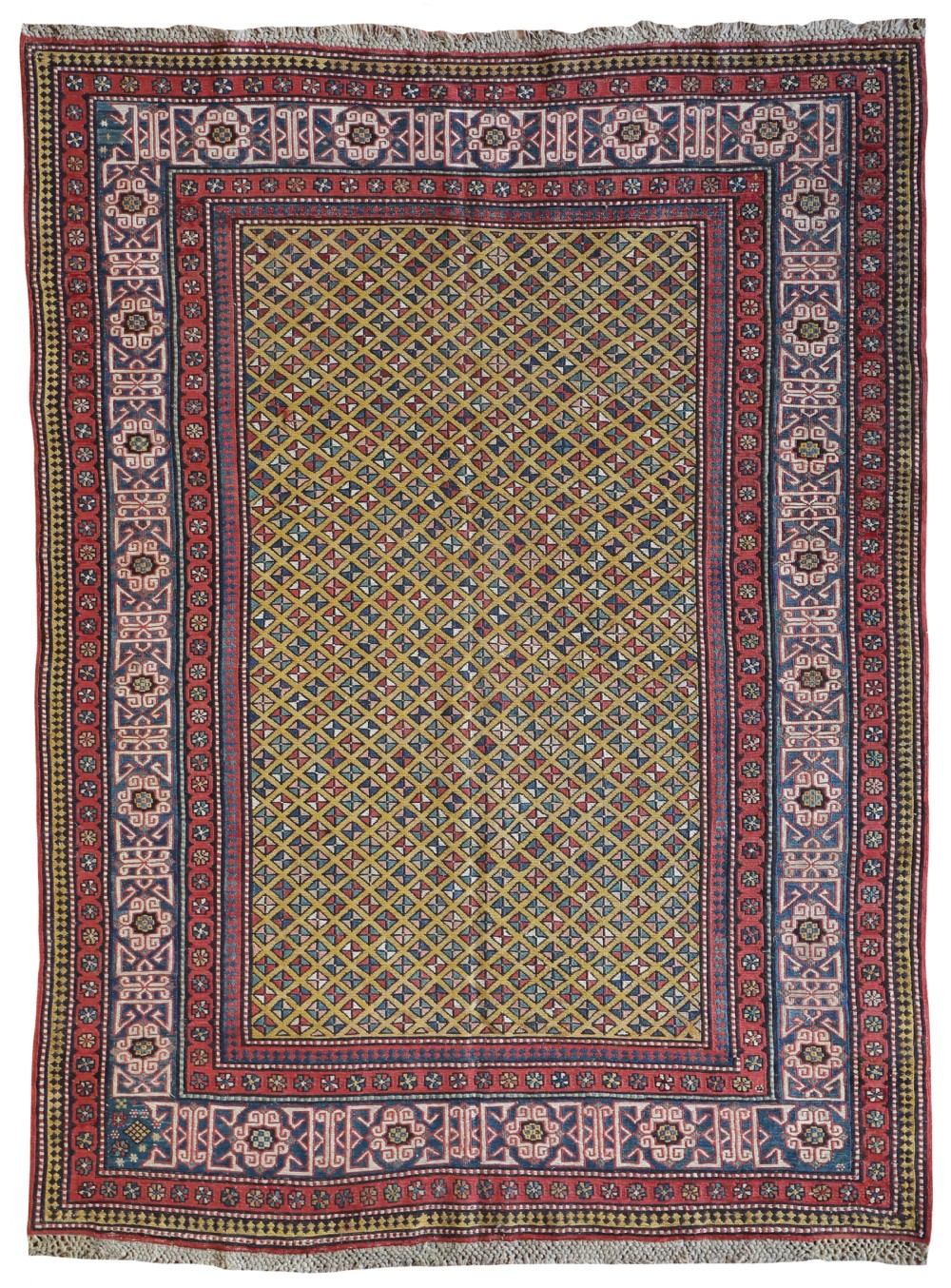 An antique Caucasian Kuba Soumac flat-weave wool rug featuring a yellow lattice central field enclosed by multi-coloured geometric borders in red, blue, and white.