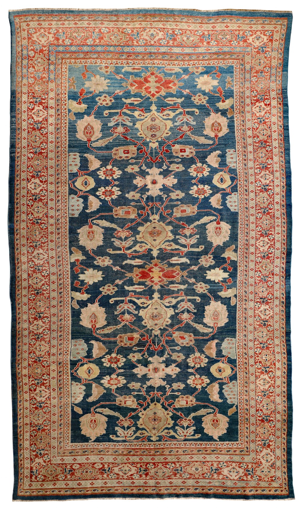 A rectangular hand-knotted Persian Ziegler carpet featuring a deep blue central field adorned with ivory and terracotta floral palmettes, surrounded by a detailed multi-band geometric border.