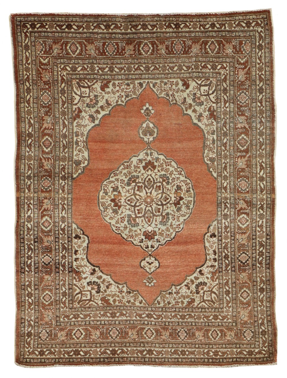 An antique hand-knotted Tabriz rug featuring a terracotta field, a central cream floral medallion, decorative spandrels, and a multi-tiered brown border.
