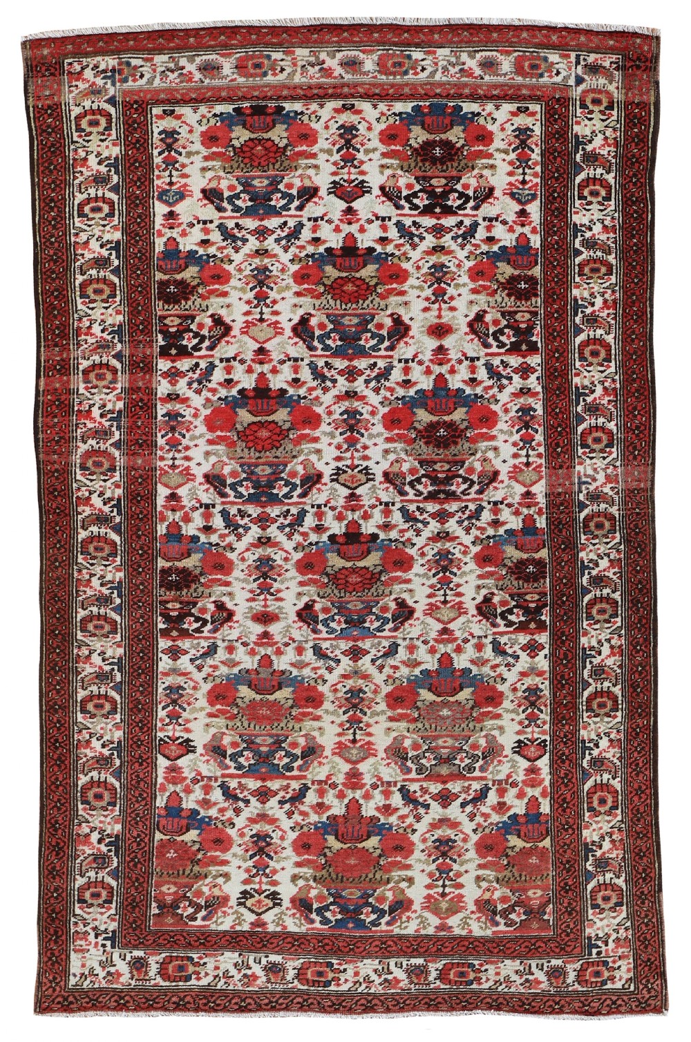 An antique Persian Malayer rug displaying a repeating red and blue floral vase pattern across a cream field with geometric borders.