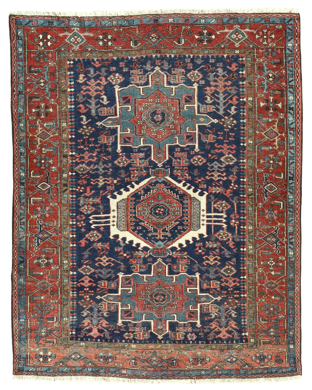 An antique Persian Karaja hand-knotted wool rug featuring three prominent geometric medallions along a deep navy blue field enclosed by a rust red border.