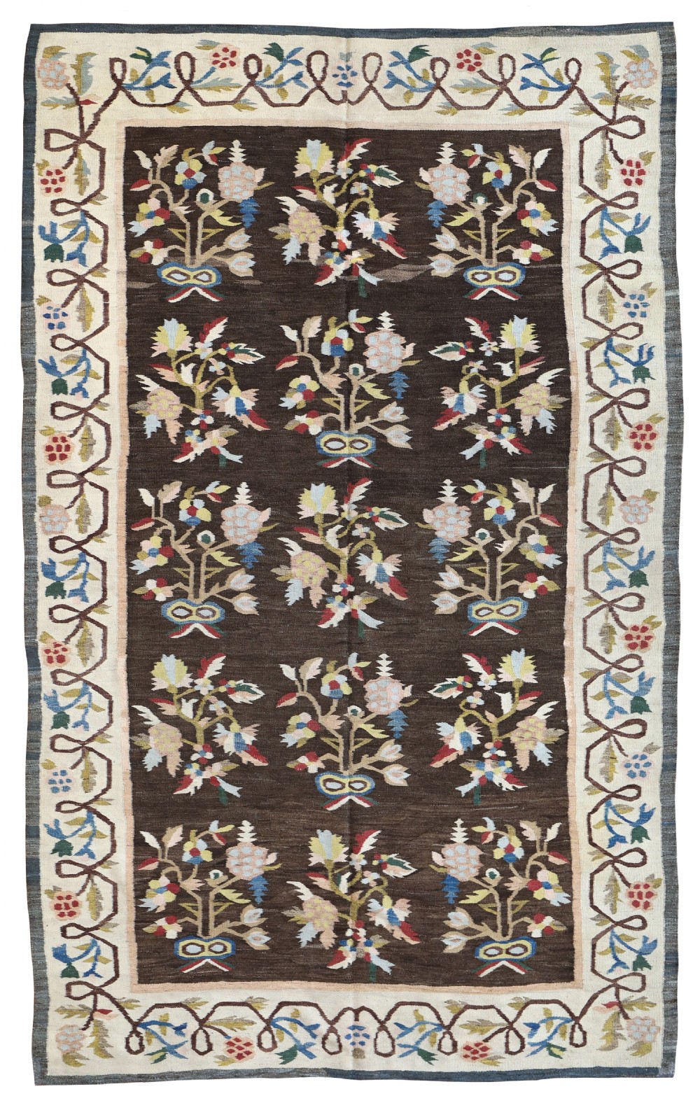 A rectangular flatweave antique Bessarabian rug featuring a dark brown central field decorated with floral bouquets and enclosed by a cream botanical vine border.