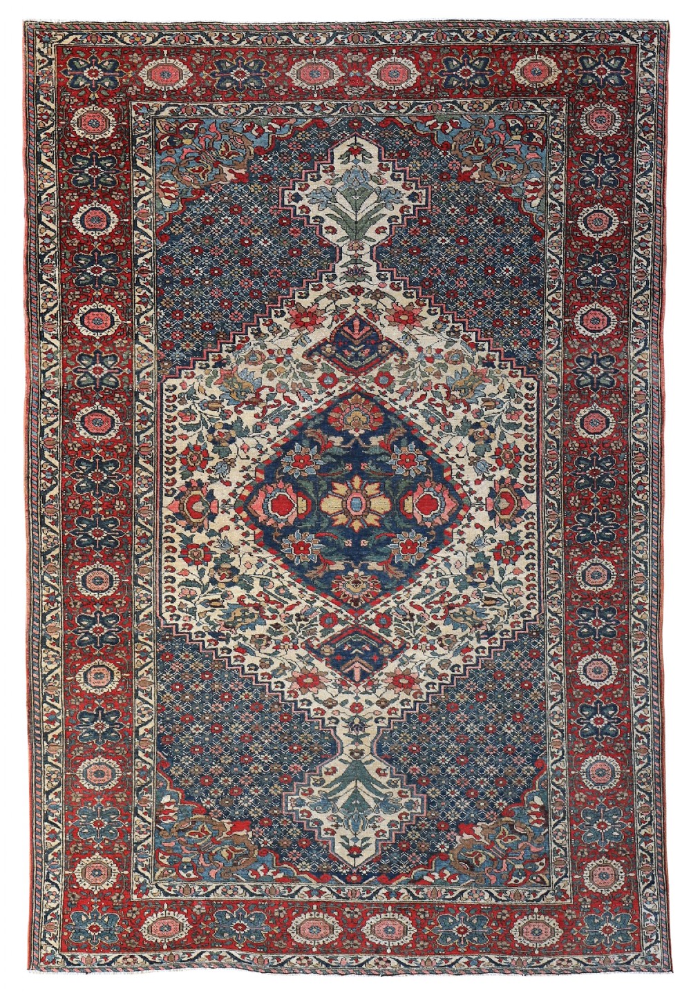 An antique Bakhtiari wool rug with a detailed navy blue and cream diamond central medallion surrounded by floral motifs and a wide red border.