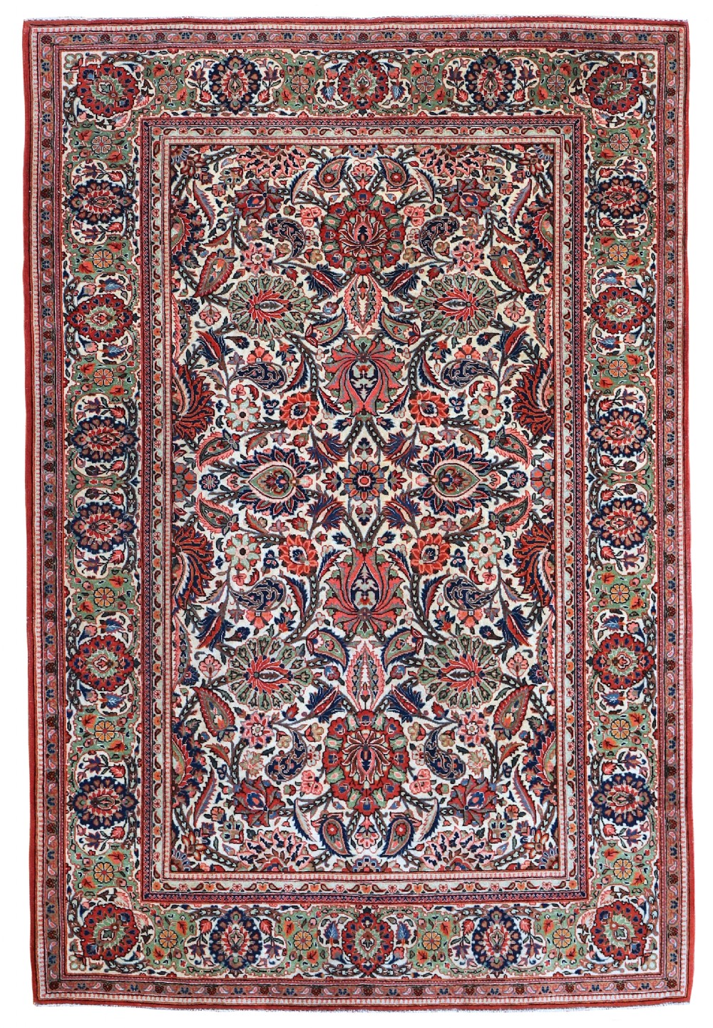 An antique hand-knotted Persian Kashan rug featuring an all-over intricate floral arabesque motif in red, navy blue, and green on a cream field with a decorative border.