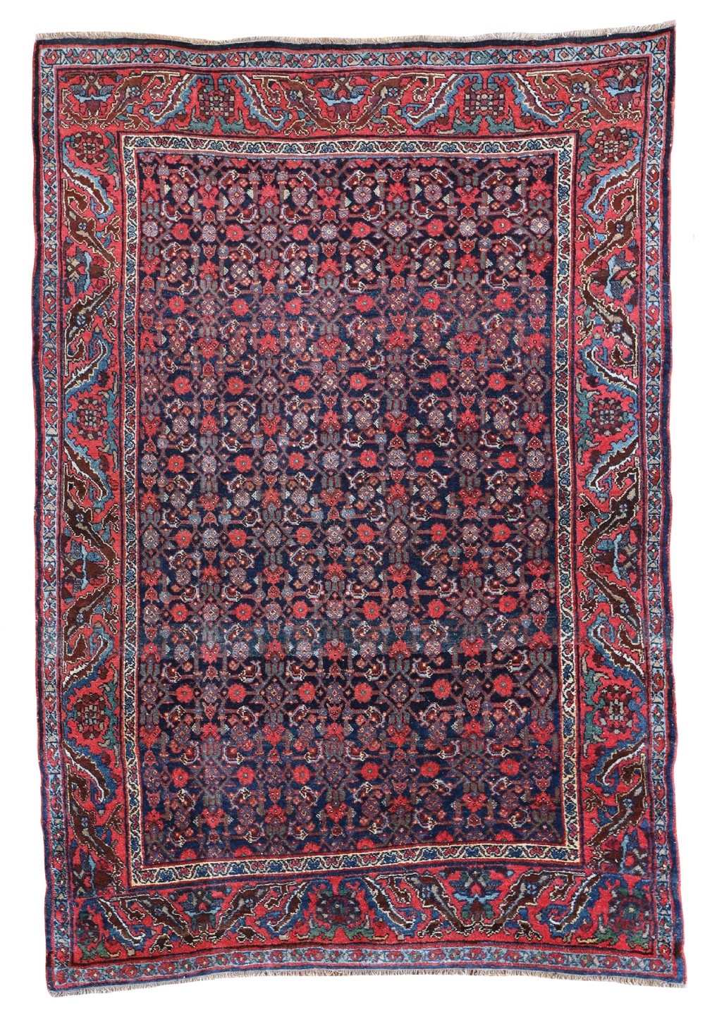 A rectangular hand-knotted antique Bidjar rug featuring a repeating floral field pattern on a deep navy ground with a wide red patterned border.