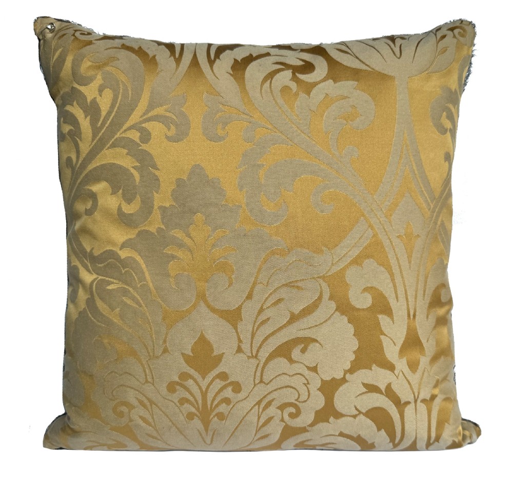 A square olive green silk cushion decorated with a woven botanical pattern in pastel pink, grey, and green tones. View III