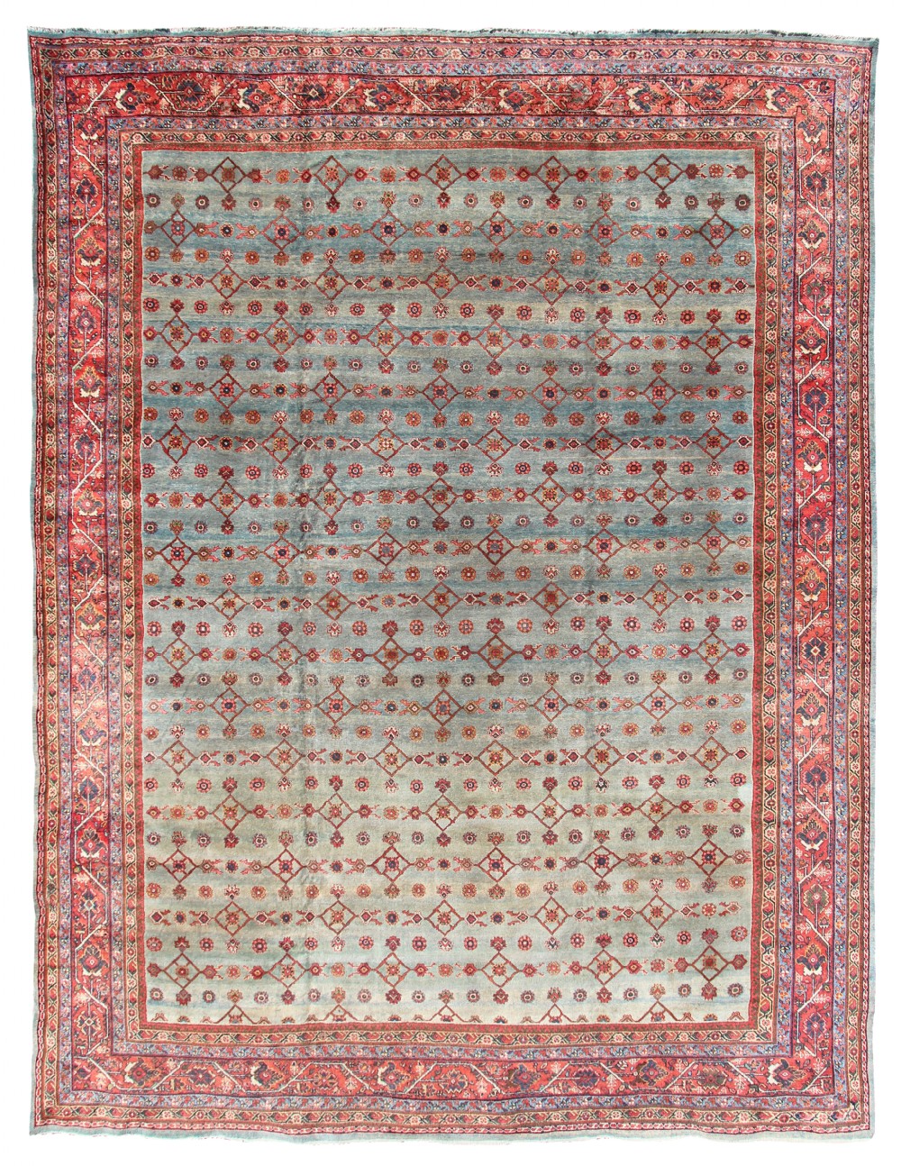 An antique Mahal Persian wool carpet featuring a muted blue field with repeating red geometric lattice motifs and a wide red floral border.