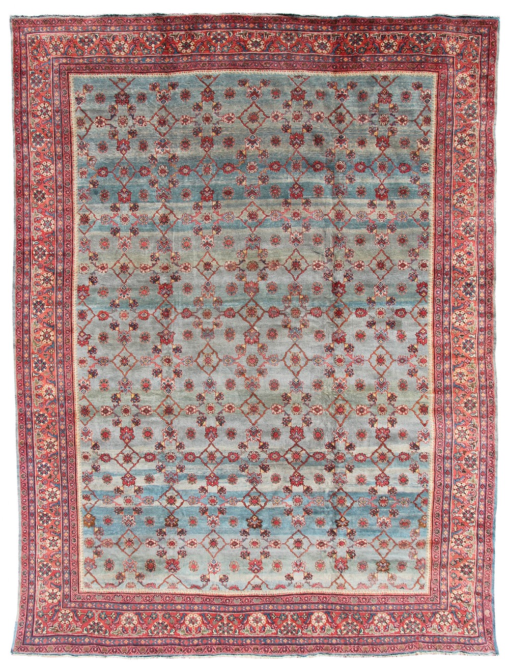 A large hand-knotted Persian Mahal carpet featuring a light blue field with an all-over red lattice floral pattern enclosed by a multi-tiered terracotta border.