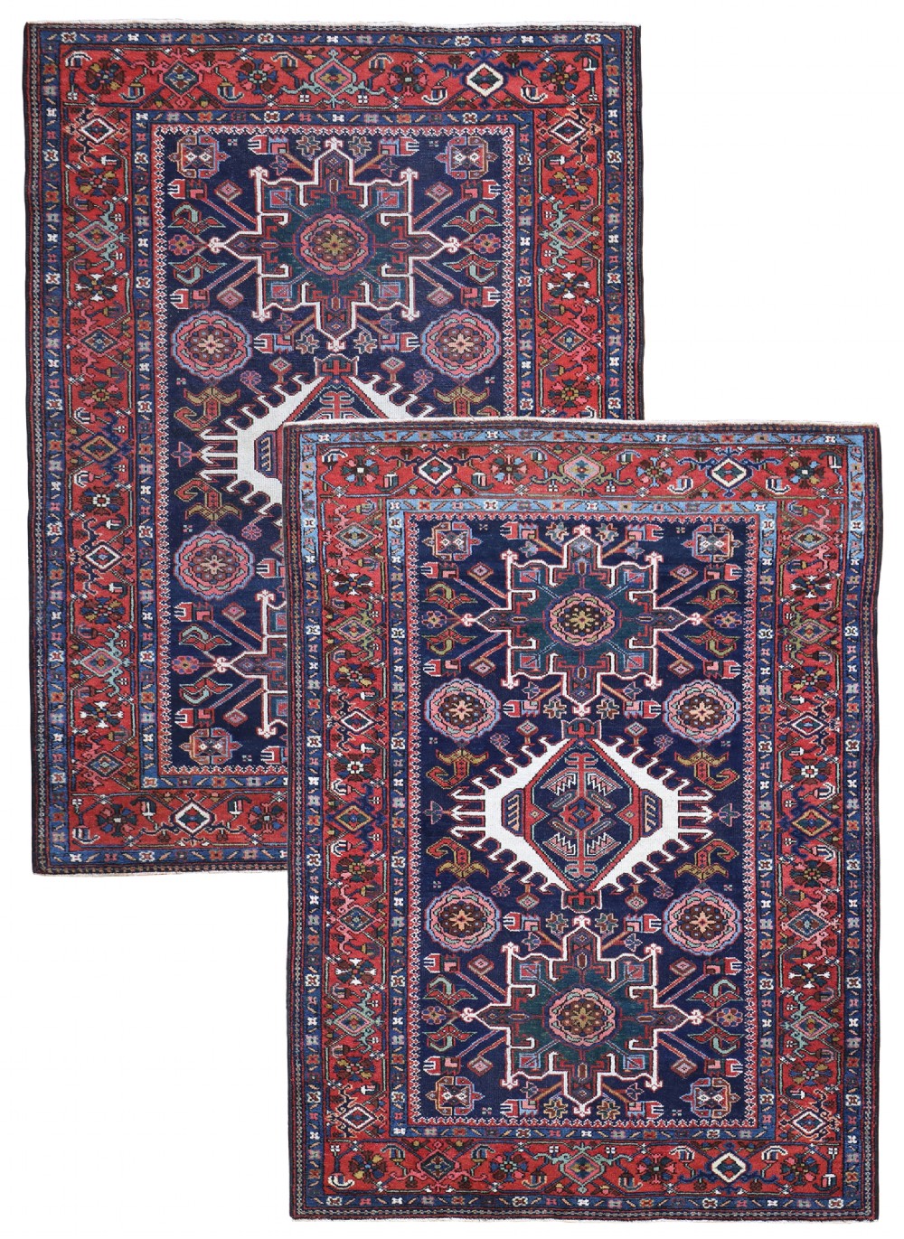 A matching pair of antique hand-knotted Karaja rugs featuring navy blue fields with central ivory geometric medallions and red borders.