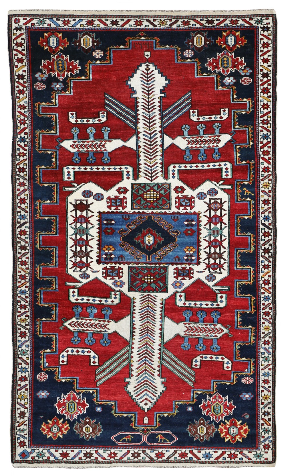 A rectangular hand-knotted antique Shirvan wool rug featuring geometric medallion patterns in red, navy blue, and cream.