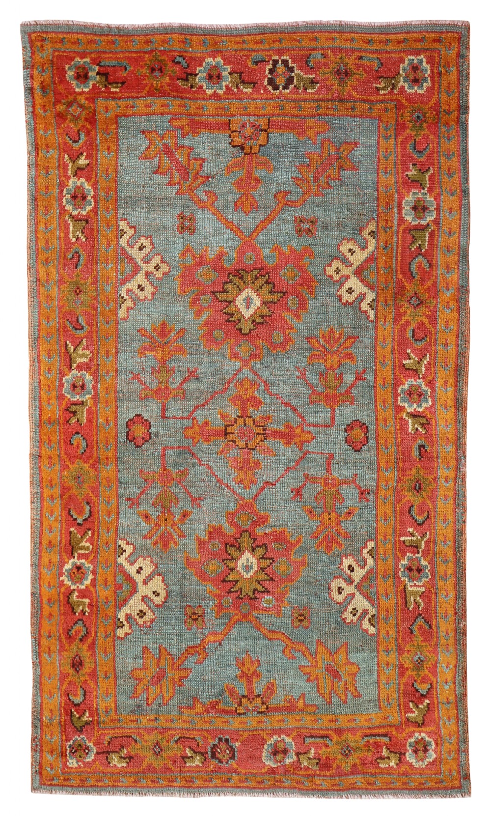 An antique hand-knotted Ushak wool rug featuring a soft blue central field with terracotta floral medallions framed by an ornate terracotta border.