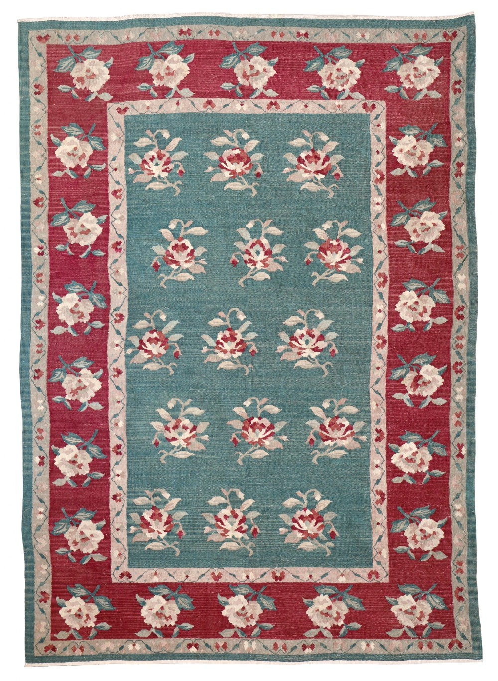 A rectangular antique handwoven wool Bessarabian kilim rug featuring a teal central field surrounded by a wide crimson border, filled with repeating stylized rose motifs.