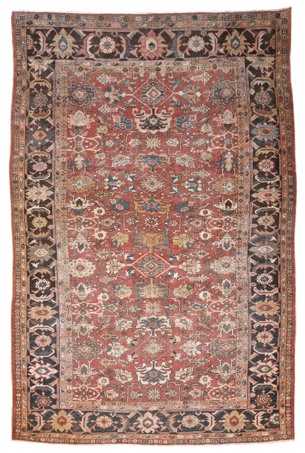 An antique hand-knotted Persian Mahal carpet featuring a terracotta red field filled with intricate floral motifs and framed by a dark navy decorative border.