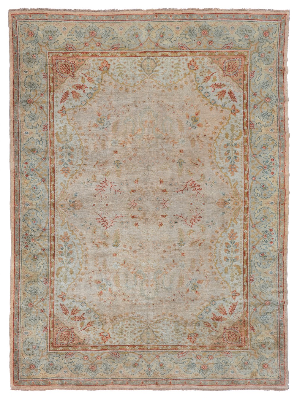A hand-knotted antique Ushak wool carpet featuring a muted beige field with subtle terracotta floral motifs and a framed pale sage border.