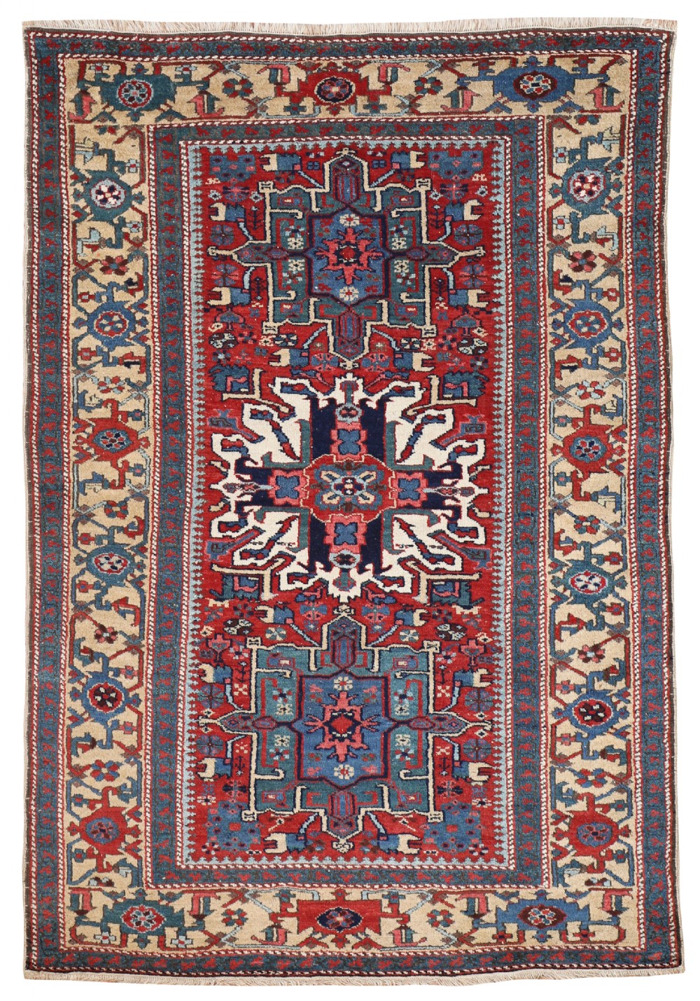 An antique hand-knotted Karaja rug featuring a red central field, three geometric medallions in navy blue and ivory, and an ornate border.