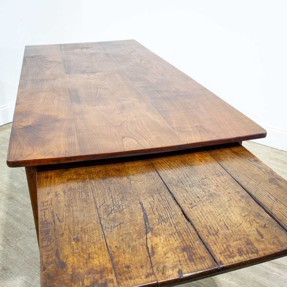 A 19th-century French fruitwood farmhouse dining table featuring a rectangular plank top, tapered square legs, and a single frieze drawer. View VIII