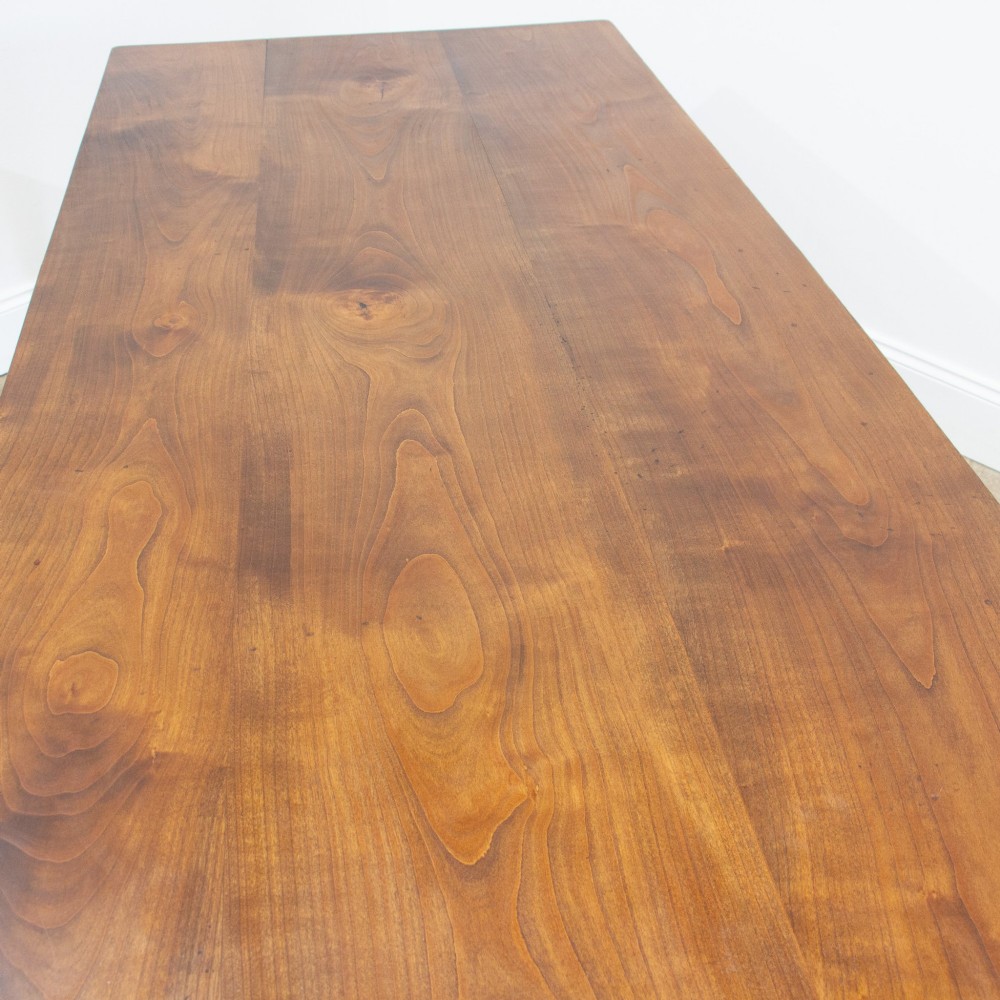 A 19th-century French fruitwood farmhouse dining table featuring a rectangular plank top, tapered square legs, and a single frieze drawer. View II