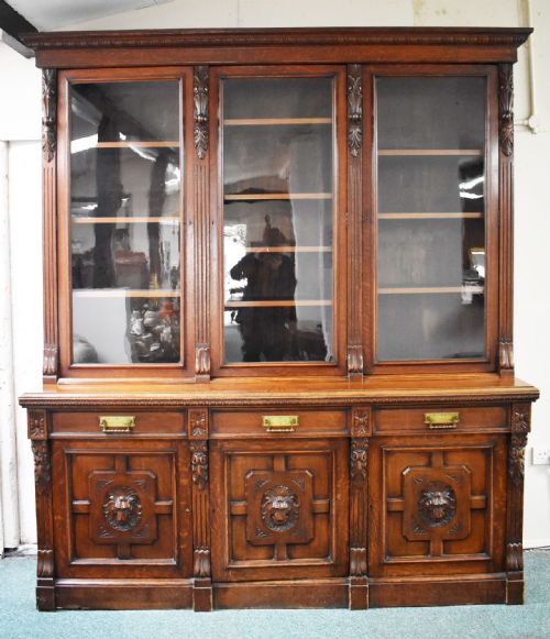 VICTORIAN CARVED OAK THREE DOOR BOOKCASE