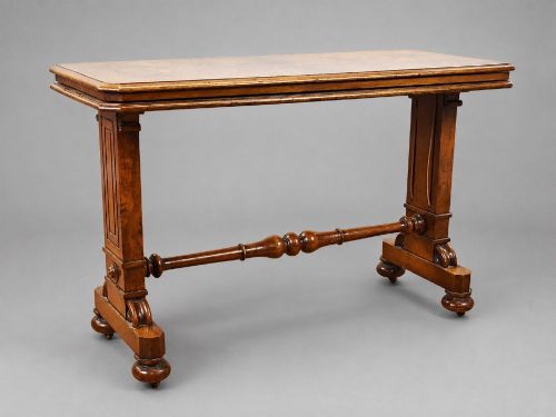 fig 1. A Victorian burr walnut three-tier telescopic dumbwaiter featuring adjustable shelves resting on carved trestle supports.