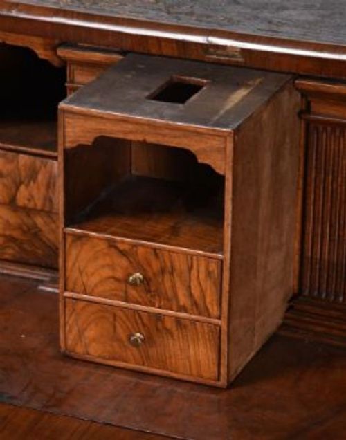 A George II burr walnut bureau bookcase featuring an upper double-door cabinet with shaped mirrored panels over a fall-front desk and four drawers with brass handles. View X