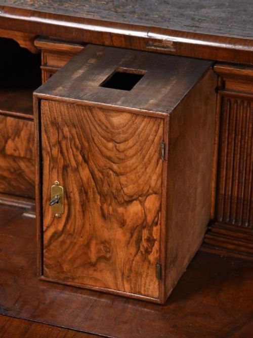 A George II burr walnut bureau bookcase featuring an upper double-door cabinet with shaped mirrored panels over a fall-front desk and four drawers with brass handles. View XI