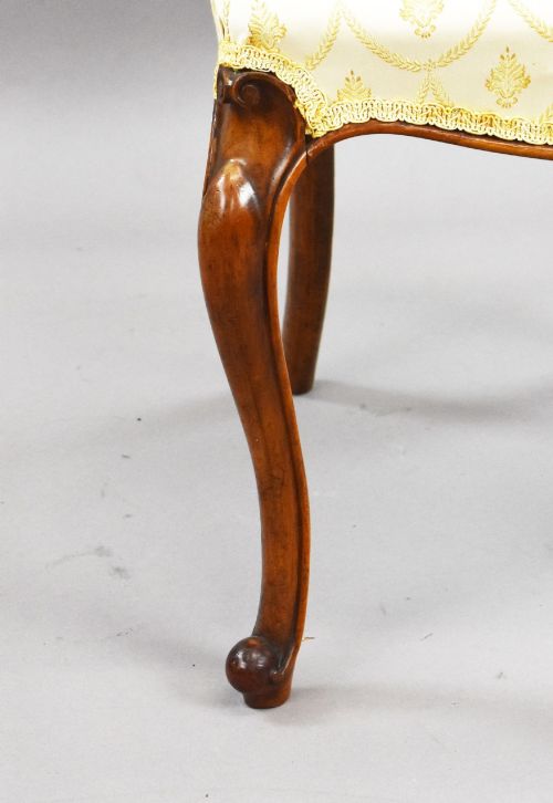 fig 4. A set of four Victorian walnut balloon back dining chairs with carved horizontal splats, cabriole front legs, and cream pattern upholstered seats.