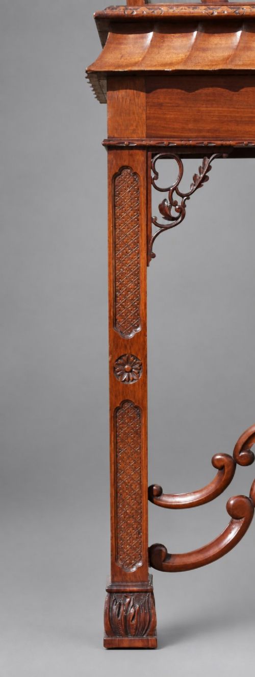 fig 5. A late Victorian mahogany display cabinet in the Chinese Chippendale style with a pierced cresting, glazed tracery doors, and carved legs with an under-tier.