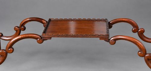 fig 6. A late Victorian mahogany display cabinet in the Chinese Chippendale style with a pierced cresting, glazed tracery doors, and carved legs with an under-tier.